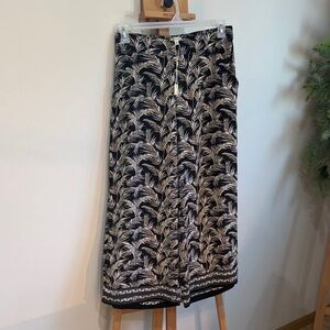 Max Studio Black and Cream Leaf Print Palazzo Pants with a leaf pattern